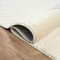 Rundt børnegulvtæppe - Ø 120 cm - Beige med dinosaur - Eclipse - Nordstrand Home